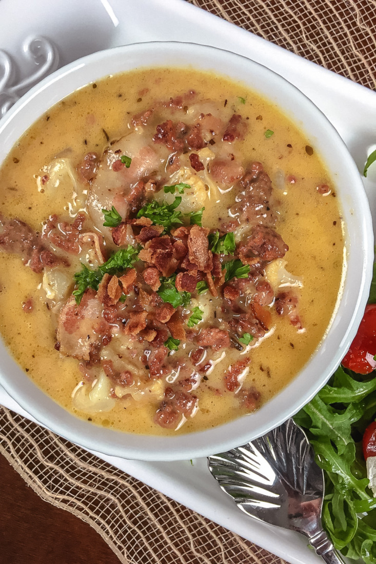 This One Pot Keto Bacon Cheeseburger soup is filled with ground beef, cheese, cauliflower, and bacon for a filling and tasty meal.
