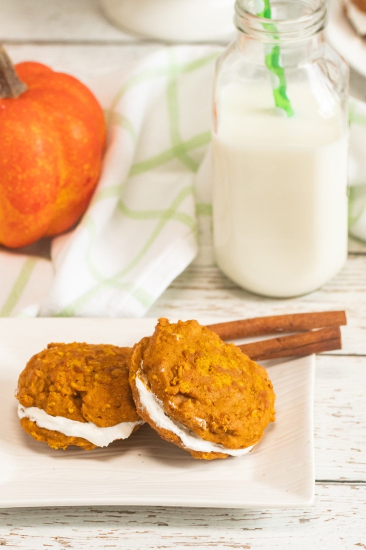 Soft and tender pumpkin oatmeal whoopie pies sandwiched together with a buttery marshmallow filling. This fall cookie goes beyond your typical pumpkin spice cookie!