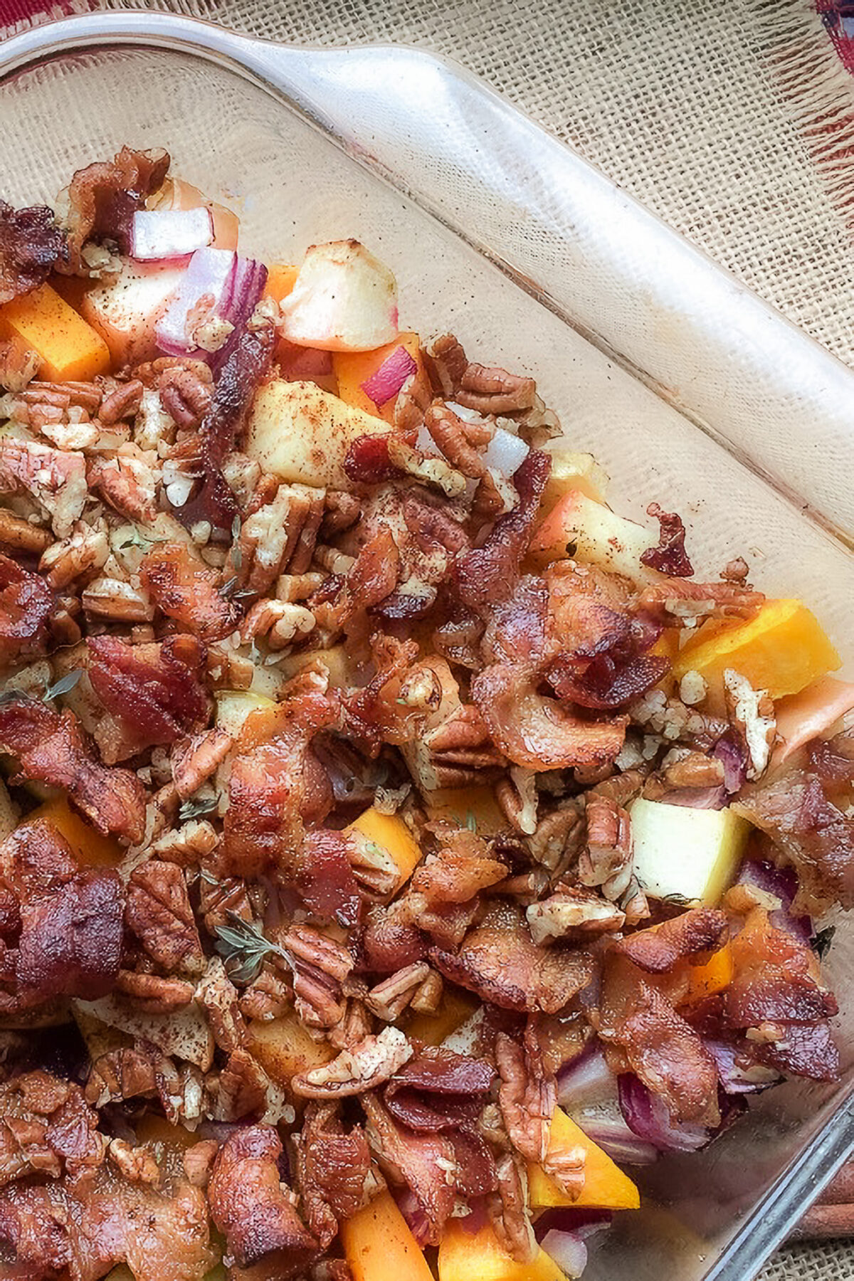 Apple Butternut Squash Casserole with bacon, pecans, and honey is a sweet and savoury holiday side dish with warm fall flavours.