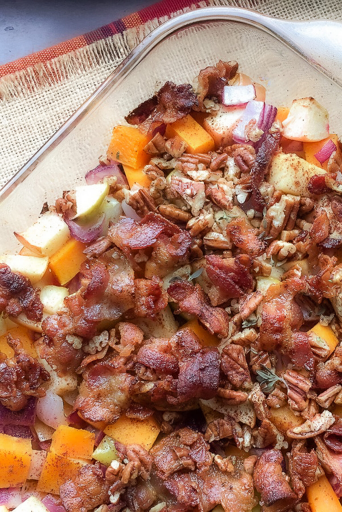 Apple Butternut Squash Casserole with bacon, pecans, and honey is a sweet and savoury holiday side dish with warm fall flavours.