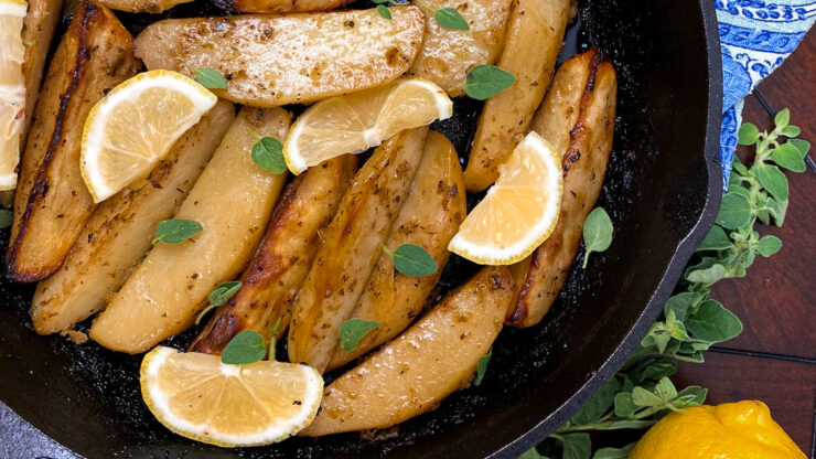 Greek Lemon Potatoes are cooked in a flavourful lemon garlic broth and then are roasted to golden perfection.