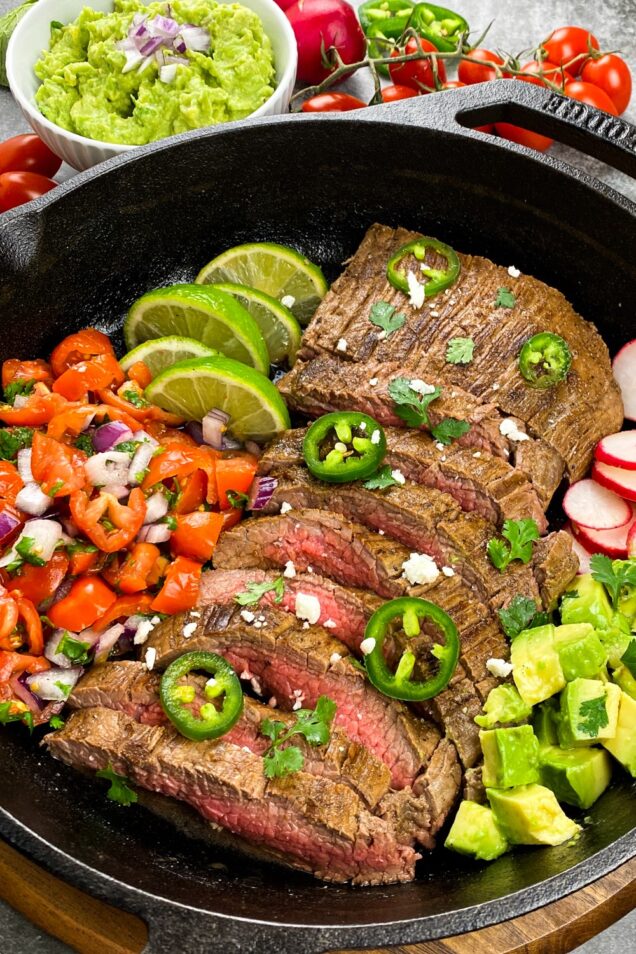 This Skillet Carne Asada features a steak marinated in a perfect combination of citrus, chili and cilantro for the most flavourful tacos.