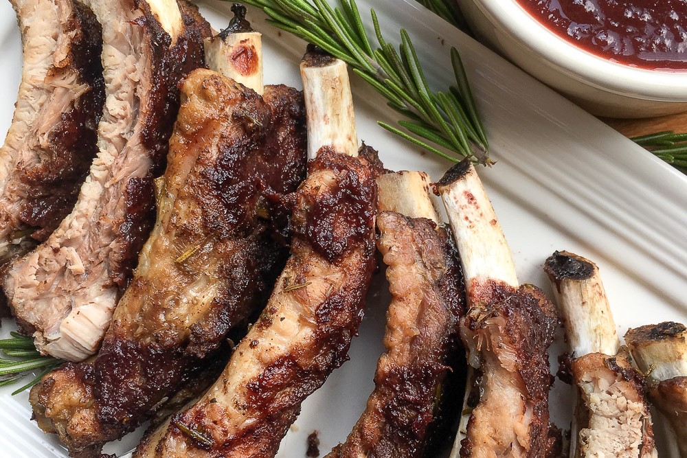 These quick and easy Instant Pot baby back ribs are perfectly tender with a hint of spice and smothered in a homemade Dark Cherry BBQ Sauce.