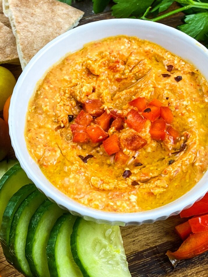 A classic Greek dip recipe, Htipiti, is a simple and easy to make spicy roasted red pepper & feta dip. Watch it disappear at any party!