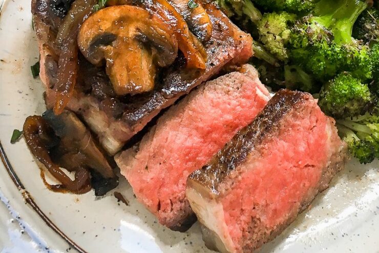 Enjoy a restaurant quality family meal you can easily make at home with this Sous Vide Strip Steak with Carmelized Onions & Mushrooms. Serve with blackened Brocolli or your favourite side dish.
