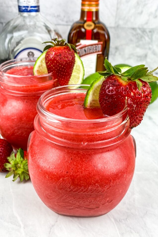 Make this refreshing 5 ingredient Chili's Frozen Strawberry Margarita Recipe in a blender in under 5 minutes. Serve it all summer long!