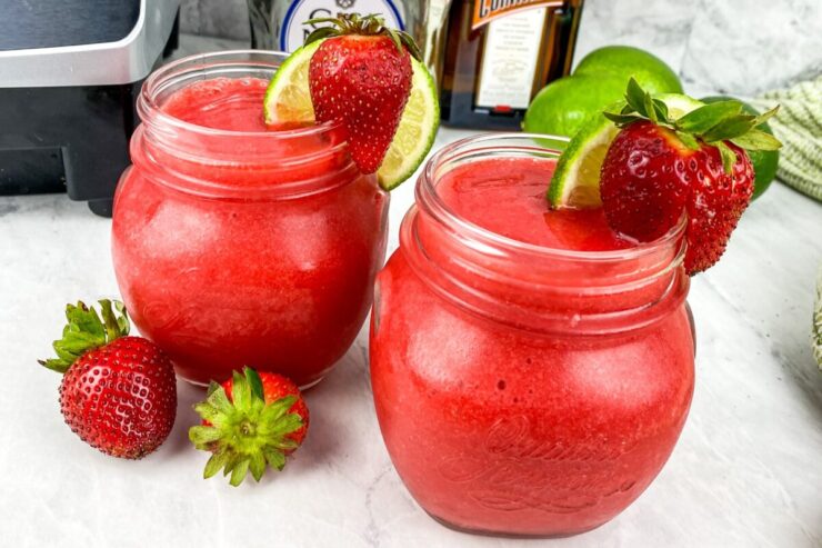 Make this refreshing 5 ingredient Chili's Frozen Strawberry Margarita Recipe in a blender in under 5 minutes. Serve it all summer long!