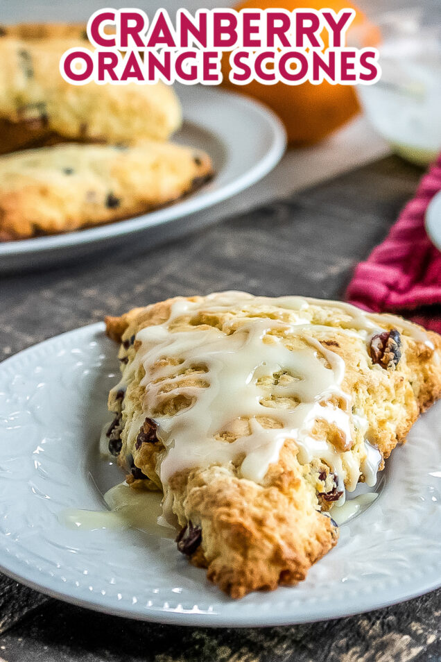 This Cranberry Orange Scone recipe is a Starbucks copycat that features dried cranberries and orange zest, drizzled with orange icing.