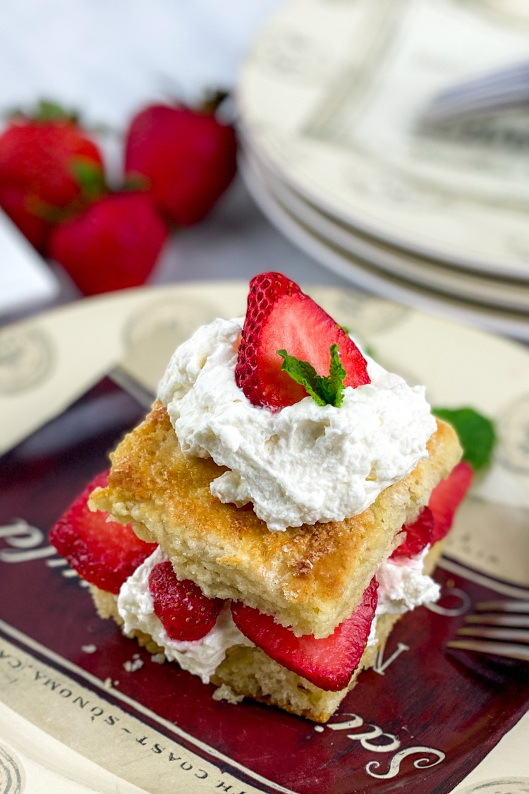 This is a traditional strawberry shortcake recipe made from scratch with fluffy shortcake, fresh macerated strawberries & real whipped cream.
