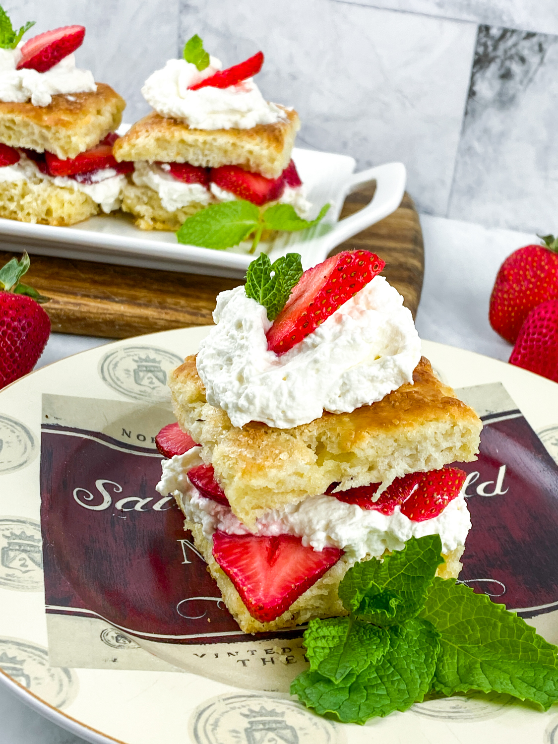 This is a traditional strawberry shortcake recipe made from scratch with fluffy shortcake, fresh macerated strawberries & real whipped cream.