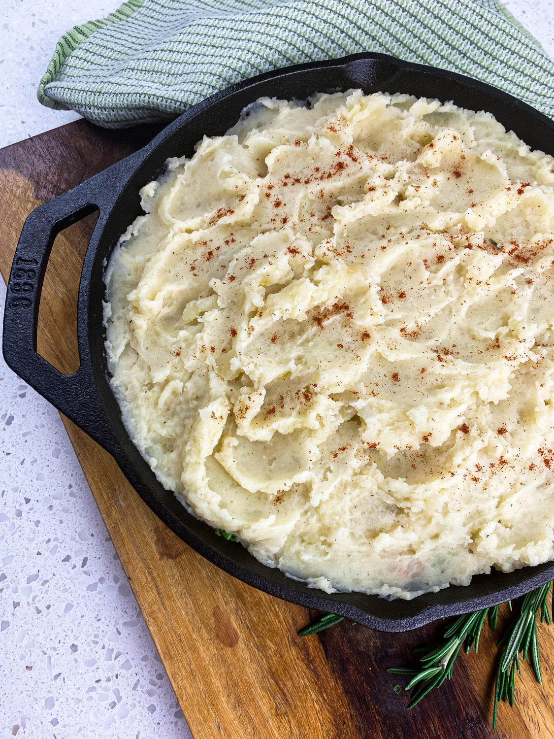 Everything in the skillet topped with fluffy mashed potatoes.