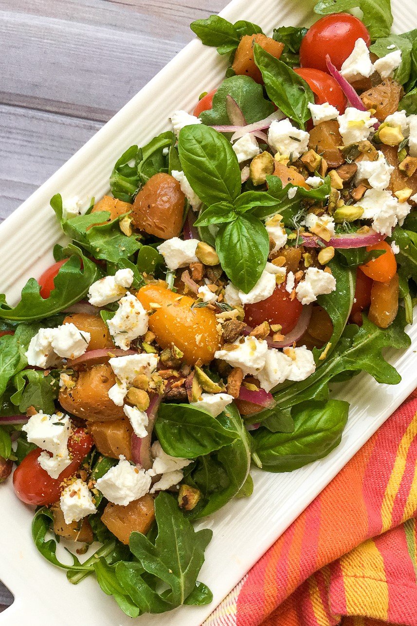 A roasted golden beet salad, tossed in a simple vinaigrette with goat cheese crumbles and fresh herbs. The perfect side dish to any meal!