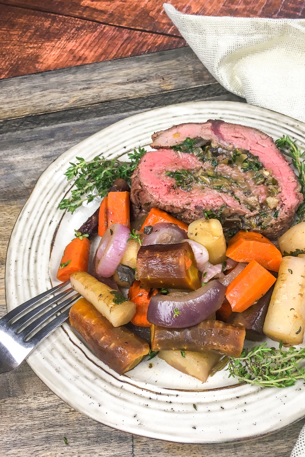 A delicious and easy spinach and mushroom-stuffed beef tenderloin recipe. Perfect for any occasion from weekday meals to Easter dinner!