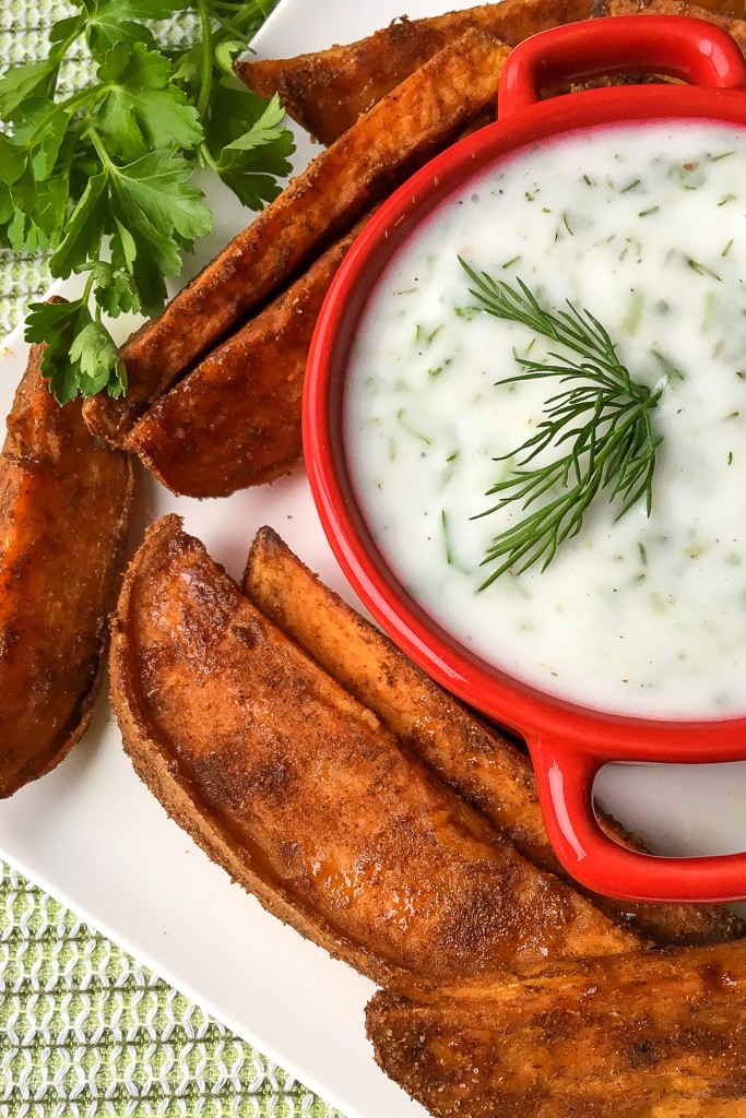 These crispy sweet potato wedges are crisp outside and soft on the inside, making them perfect for dipping in a delicious herbed yogurt dip.