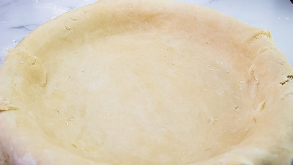 Pastry dough in a pie plate.