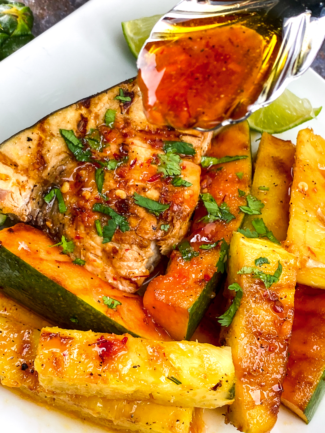 Looking for a delicious and easy recipe for swordfish? Look no further than this garlic-chili grilled swordfish with pineapple and papaya!