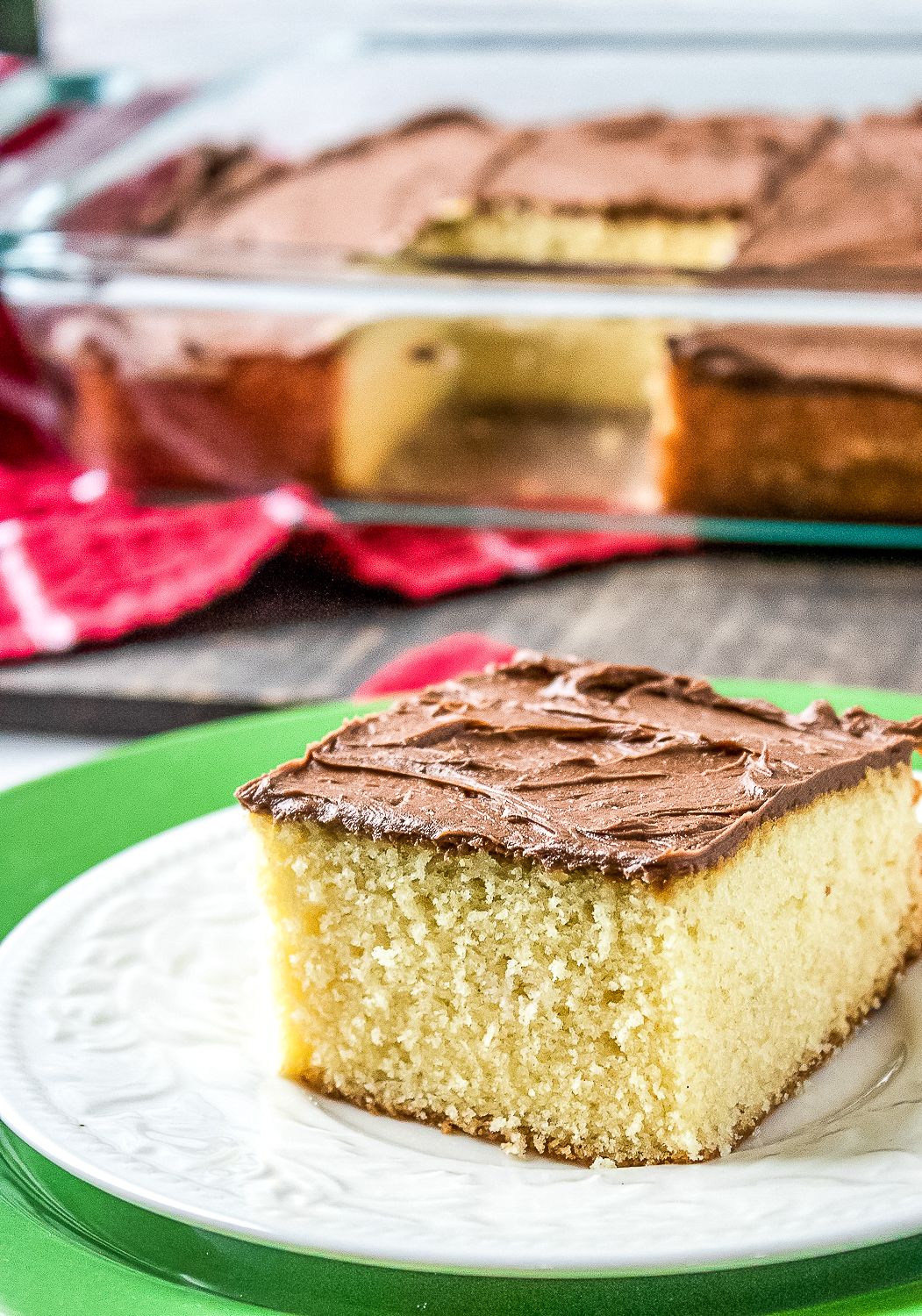 This easy yellow sheet cake recipe is perfect for any occasion! It's moist, fluffy, and topped with a rich chocolate buttercream frosting.