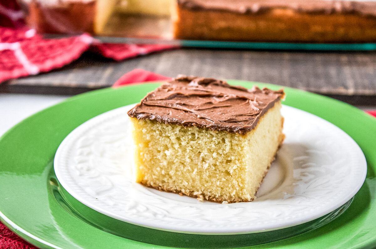 This easy yellow sheet cake recipe is perfect for any occasion! It's moist, fluffy, and topped with a rich chocolate buttercream frosting.