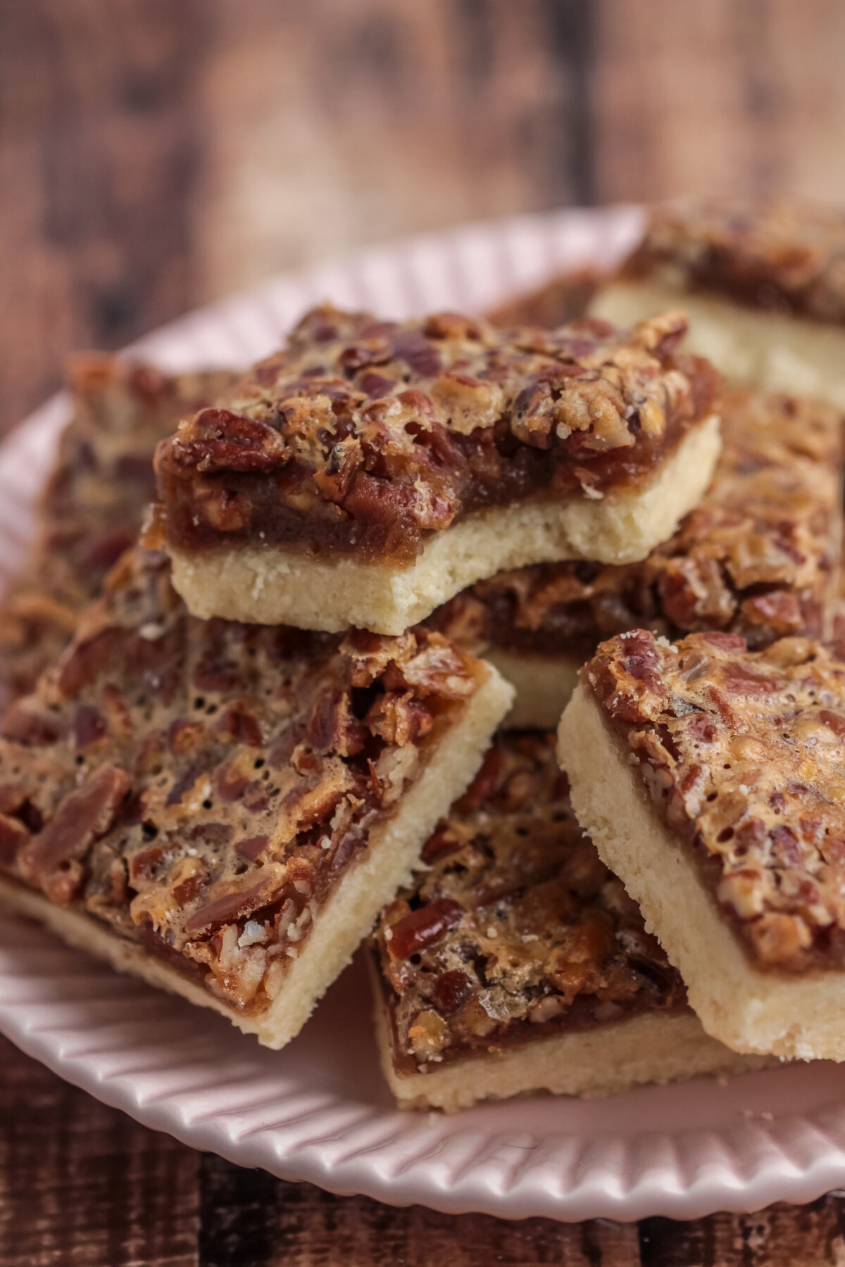 These pecan pie bars are the best dessert for family gatherings! With a gooey filling, and loads of pecans, they're sure to be a hit.