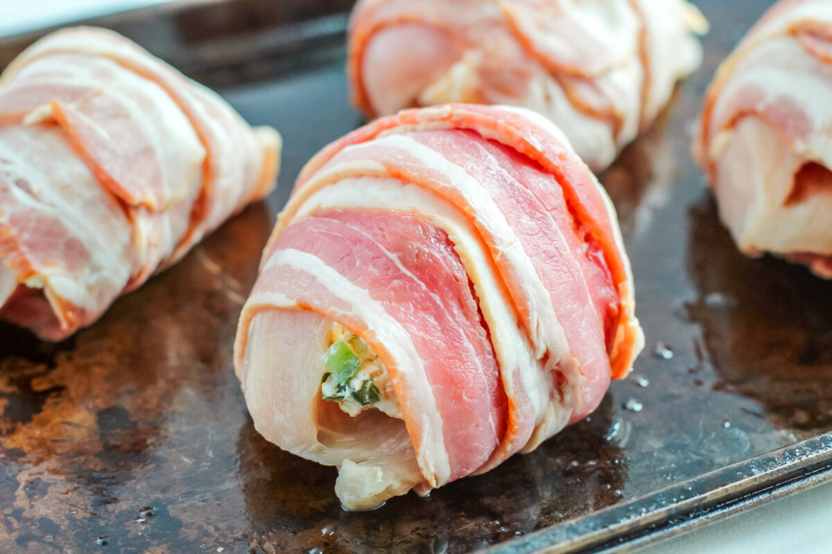 Chicken breast wrapped with bacon.,