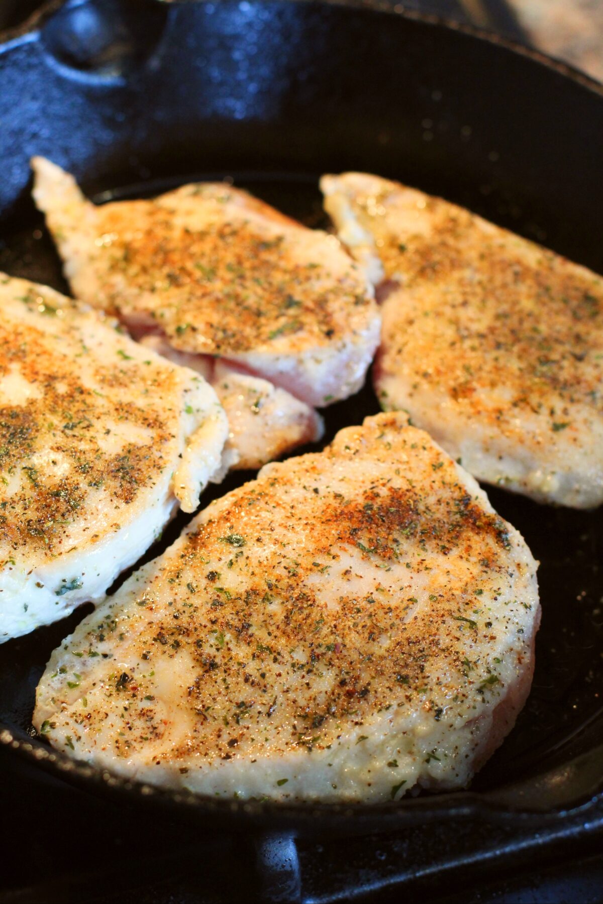 Chicken browning in the skillet.