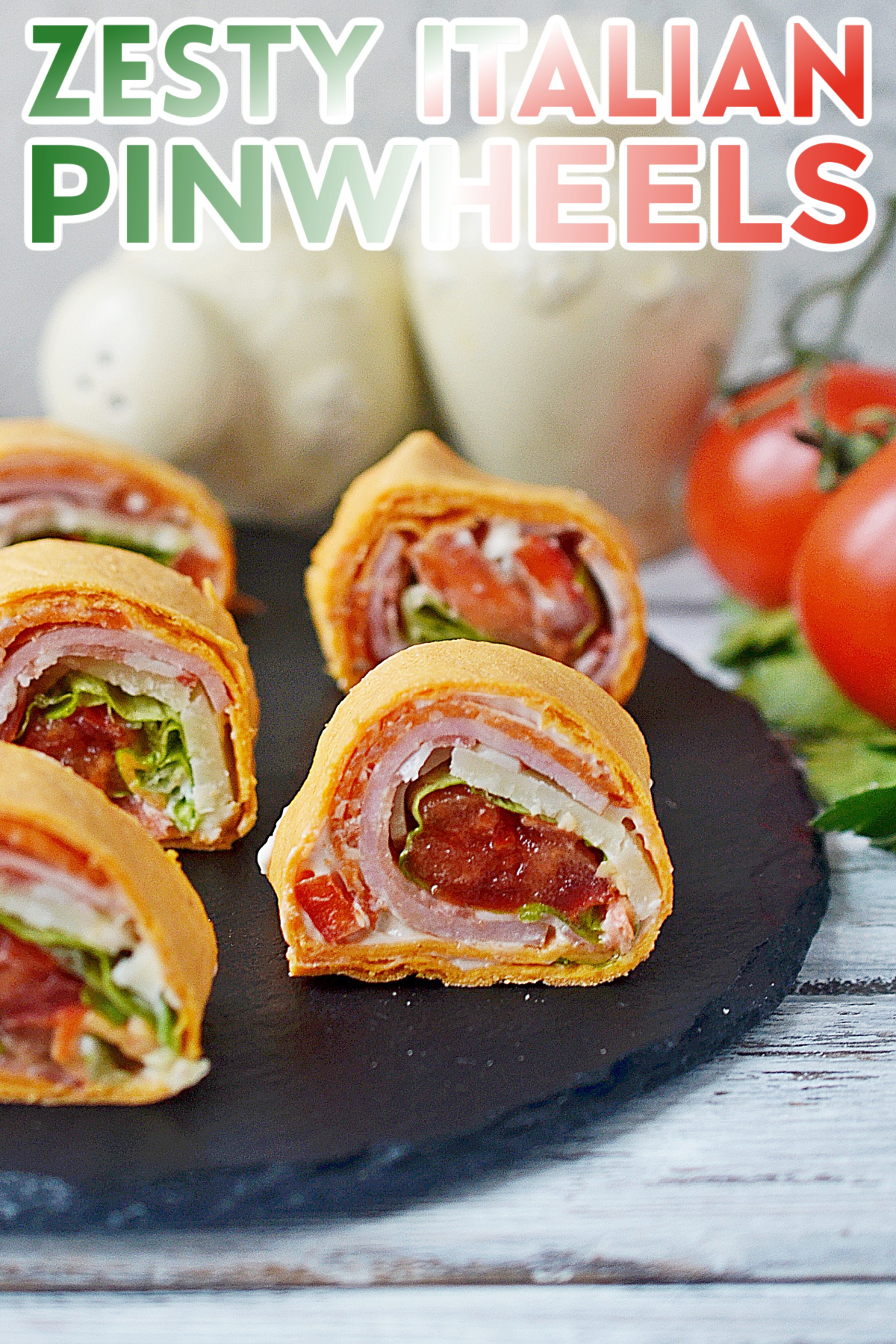 This easy Zesty Italian Pinwheels recipe is perfect for a party, potluck, or even lunch! They're always a hit with kids and adults alike.