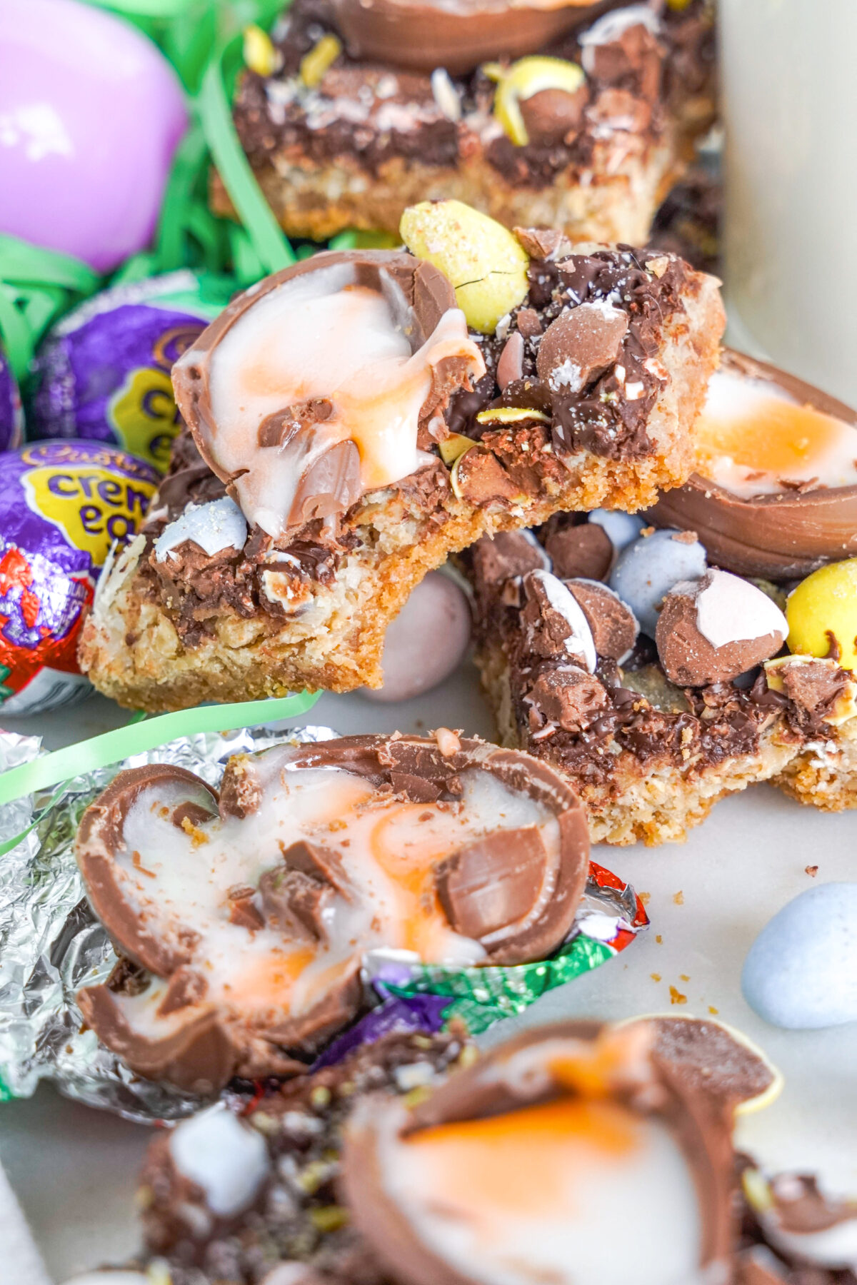 Celebrate Easter with these easy-to-make Magic Cookie Bars. These sweet, chewy bars are loaded with mini eggs, creme eggs and more!
