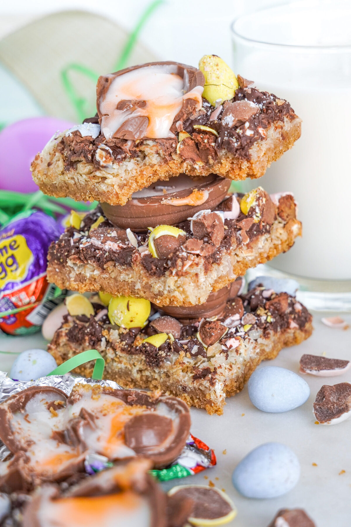 Celebrate Easter with these easy-to-make Magic Cookie Bars. These sweet, chewy bars are loaded with mini eggs, creme eggs and more!