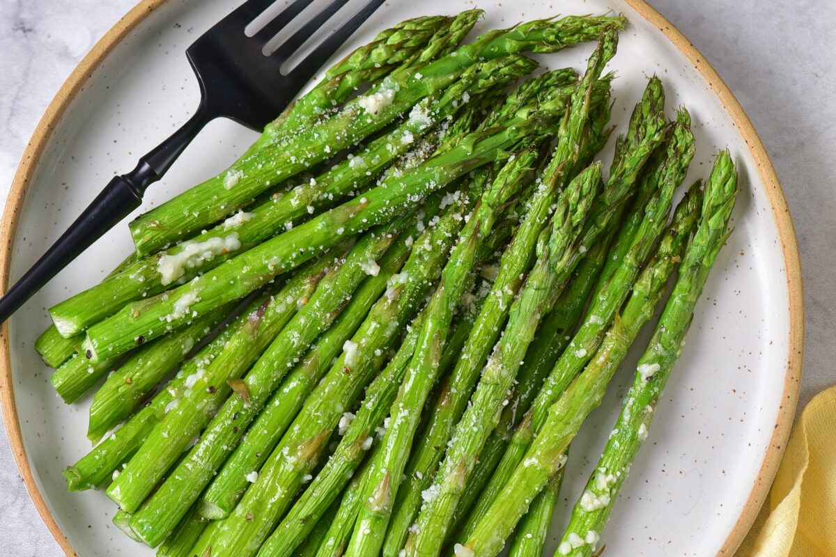 This flavourful and healthy air fryer asparagus side dish recipe is ready in just 15 minutes. Topped with Parmesan, it is sure to be a hit!