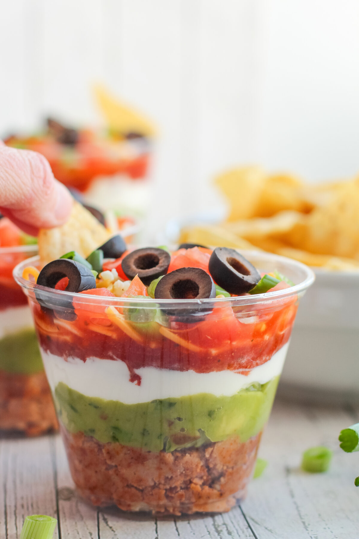 Looking for an easy individual appetizer recipe? Try out our 7 layer dip cups! Simple and delicious, it's sure to be a hit at any party!