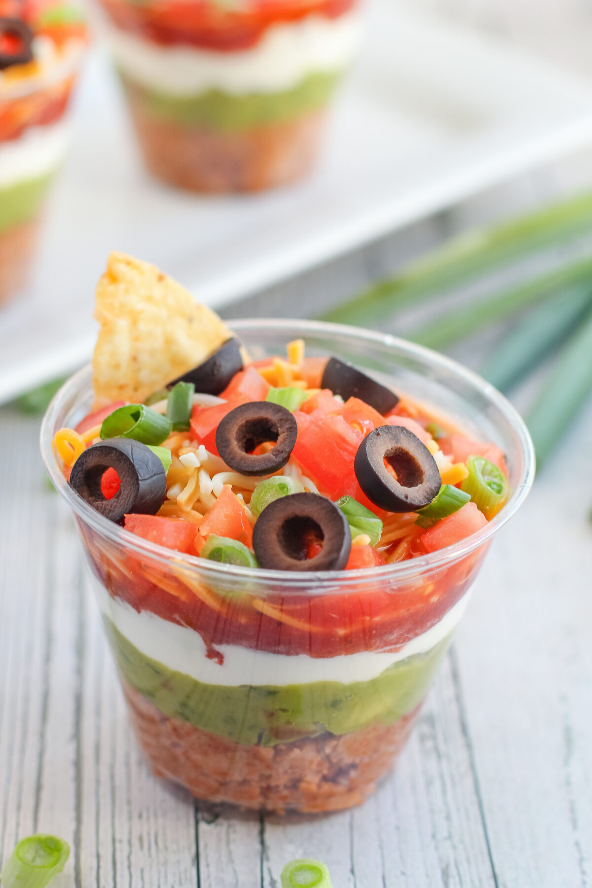 Looking for an easy individual appetizer recipe? Try out our 7 layer dip cups! Simple and delicious, it's sure to be a hit at any party!