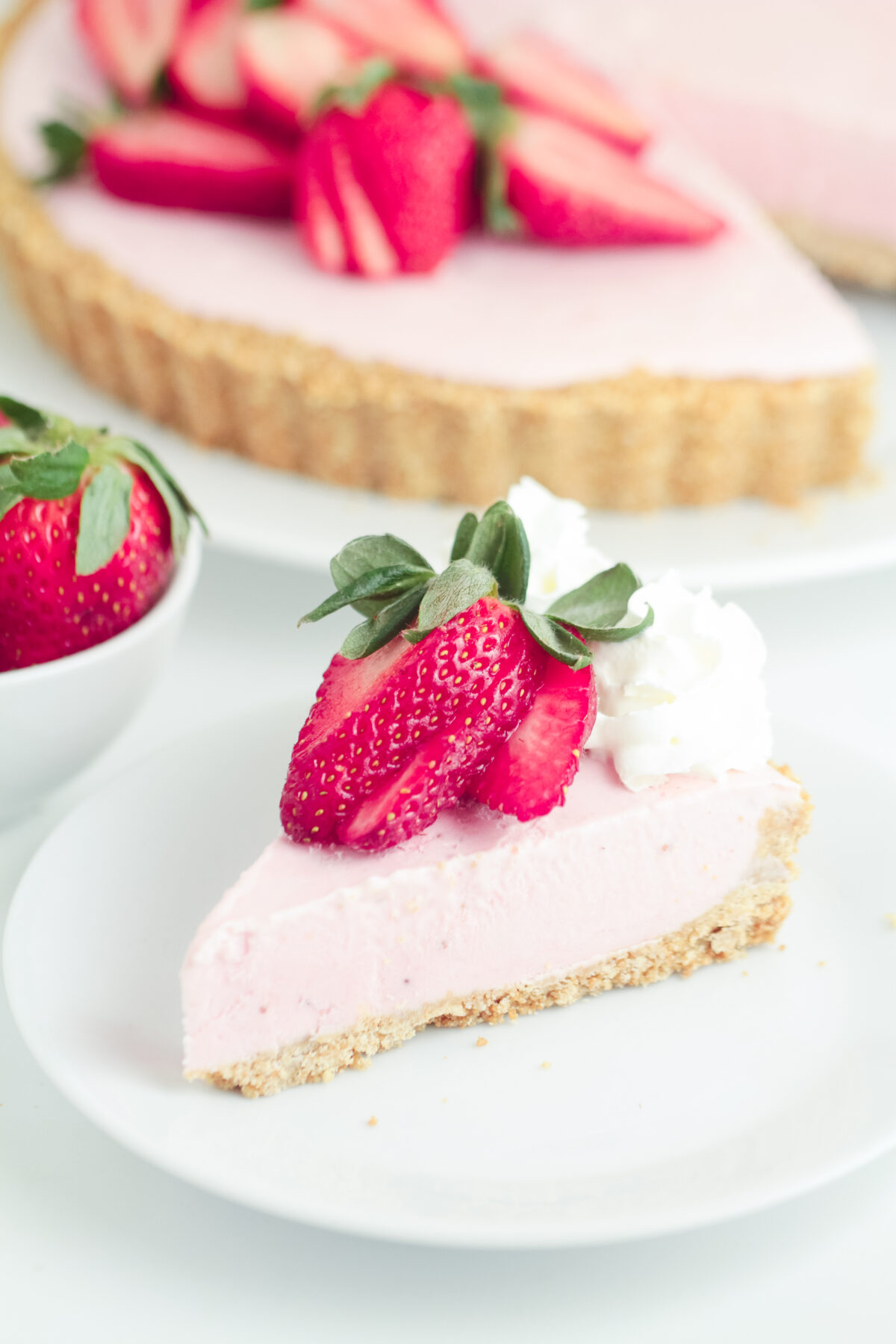 This easy No Bake Strawberry Cheesecake has a buttery cookie crust topped off with a creamy strawberry cheesecake filling.