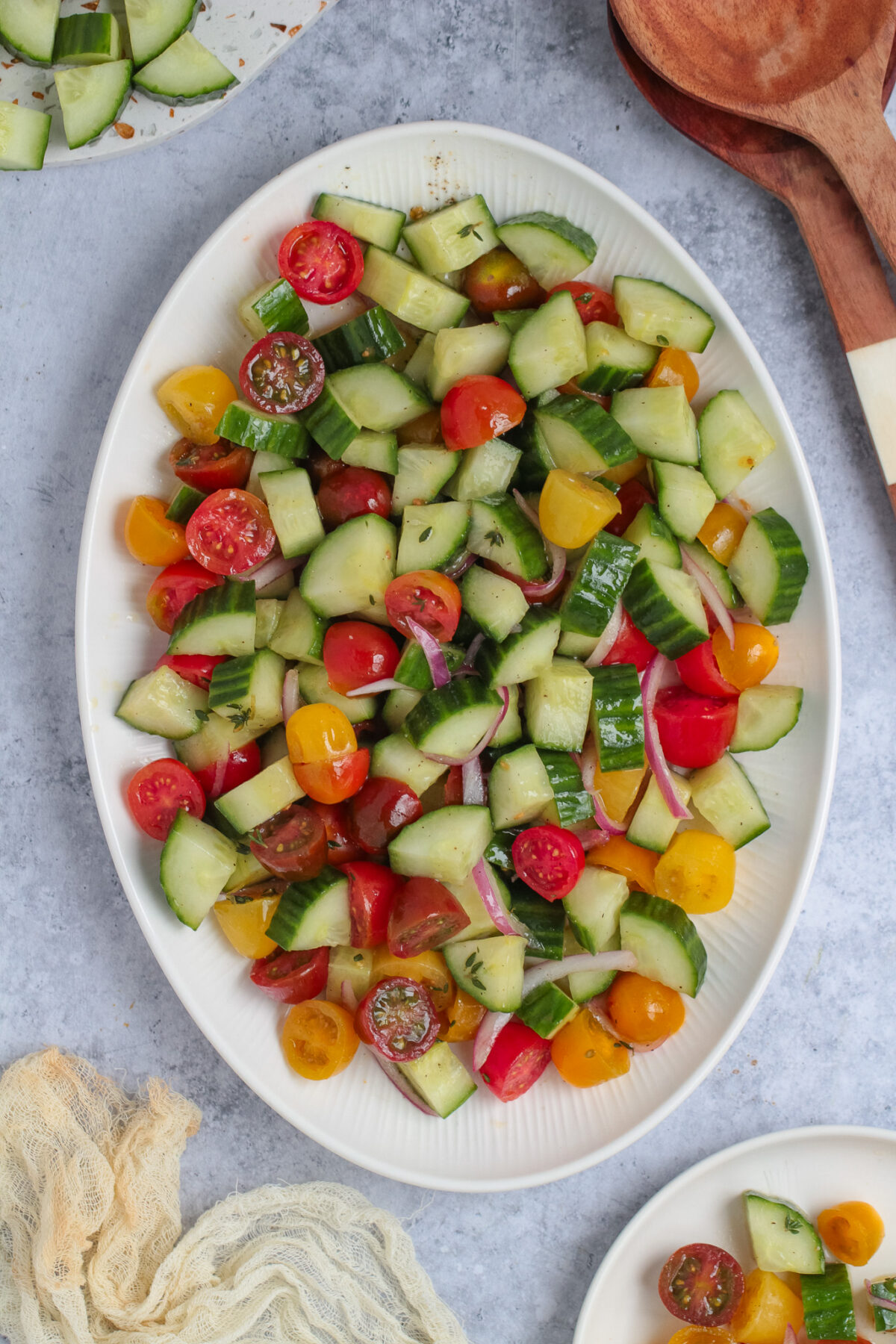 Fresh cucumber tomato salad with cherry tomatoes, red onion, thyme, and a simple vinaigrette. An easy summer side dish for any meal.