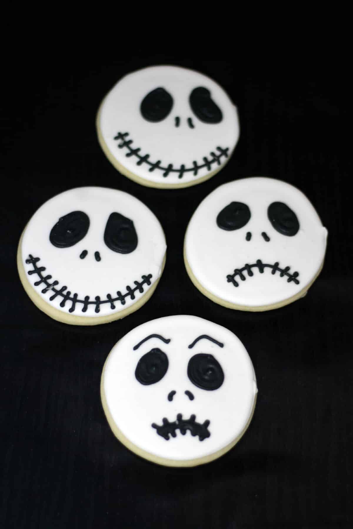 Make Jack Skellington cookies with this easy recipe and royal icing. These fun Nightmare Before Christmas cookies are perfect for Halloween!