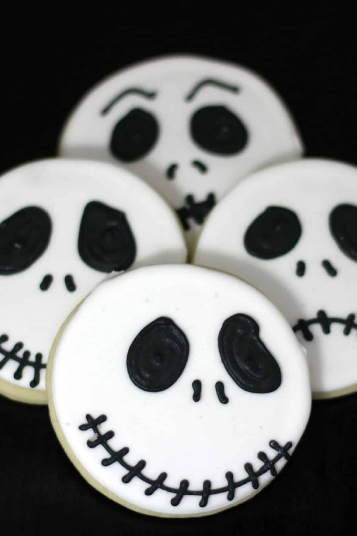 Make Jack Skellington cookies with this easy recipe and royal icing. These fun Nightmare Before Christmas cookies are perfect for Halloween!